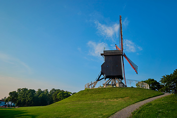 Image showing Sint-Janshuismolen Sint-Janshuis Mill windmill in Bruges on sunset, Belgium