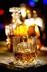 Image showing Glass of whiskey and decante