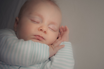 Image showing Baby boy sleeping in his bed