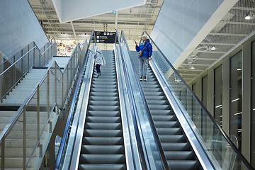 Image showing Mother and child together on escalator background. Terminal, air