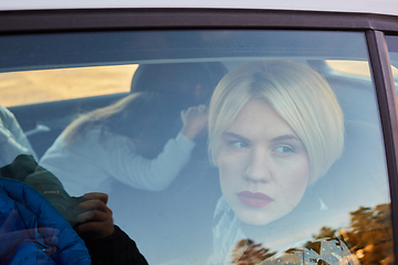 Image showing Family concept. Portrait of mother and daughter through the glass of a car