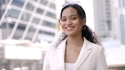 Image showing Thai Businesswoman Smiling in Front of Bangkok Skyscrapers