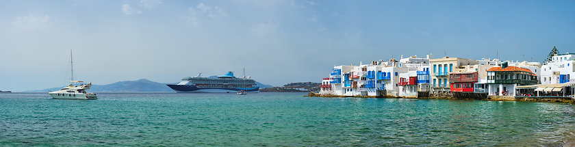 Image showing Little Venice houses in Chora Mykonos town with yacht and cruise ship. Mykonos island, Greecer