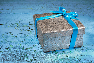 Image showing Gift box with blue ribbon