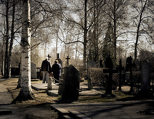 Image showing Senior couple at a grave