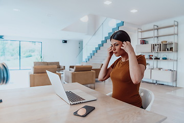 Image showing Woman sitting in living room using laptop look at cam talk by video call with business friend relatives, head shot. Job interview answering questions.