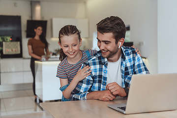 Image showing Father and daughter in modern house talking together on laptop with their family during holidays. The life of a modern family