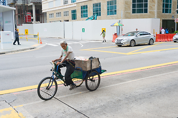 Image showing Old man riding tricycle Singapore