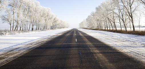 Image showing wide paved winter road