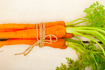 Image showing baby carrots bunch tied with rope