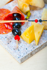 Image showing mix cold cut on a stone with fresh pears