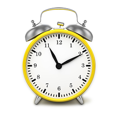 Image showing Yellow retro styled classic alarm clock isolated