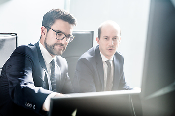 Image showing Business team analyzing data at business meeting in modern corporate office.