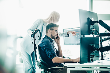 Image showing Business team analyzing data at business meeting in modern corporate office.