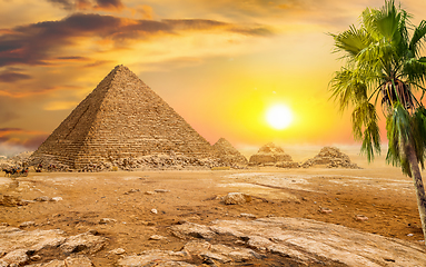 Image showing Pyramids and sun