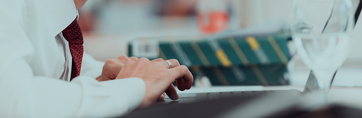 Image showing Close up of business hands are typing on laptop.