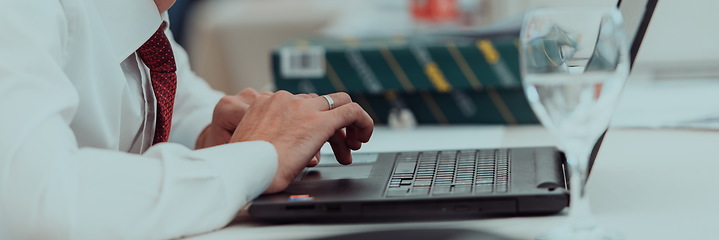 Image showing Close up of business hands are typing on laptop.