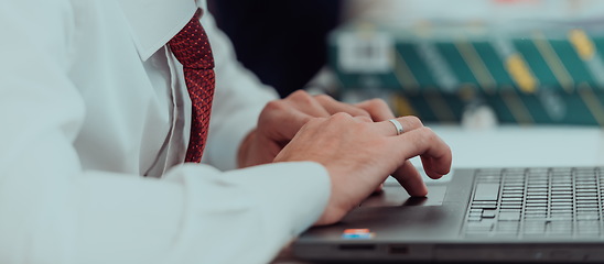 Image showing Close up of business hands are typing on laptop.