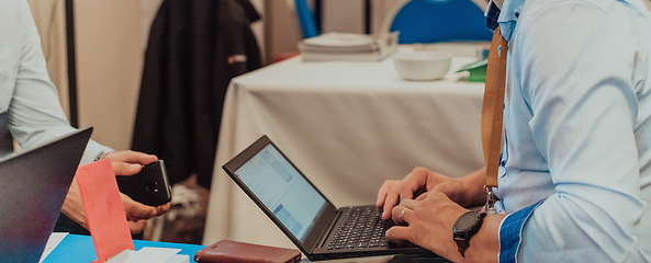 Image showing Close up of business hands are typing on laptop.