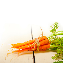 Image showing baby carrots bunch tied with rope