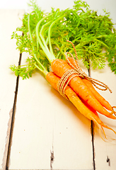 Image showing baby carrots bunch tied with rope