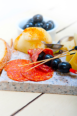 Image showing mix cold cut on a stone with fresh pears