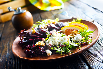 Image showing Beet with goat cheese and nuts. Top view