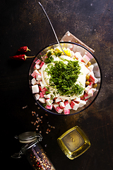 Image showing Salad of crab sticks, cheese, garlic and tomatoes, dressed with mayonnaise