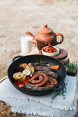 Image showing Grilled sausages with vegetables