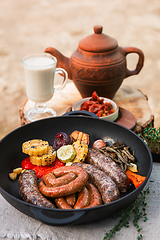 Image showing Grilled sausages with vegetables