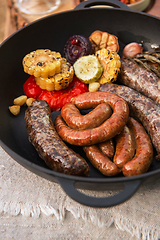 Image showing Grilled sausages with vegetables