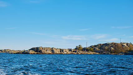 Image showing Red house at sea shore in the baltic sea in dull colors in autumn.