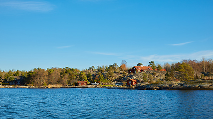 Image showing Red house at sea shore in the baltic sea in dull colors in autumn.