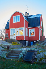 Image showing Red house at sea shore in the baltic sea in dull colors in autumn.