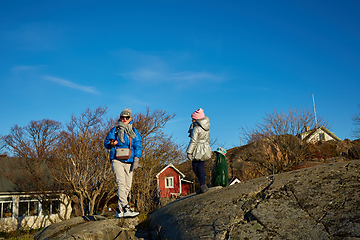 Image showing mother and little daughter travel in mountains