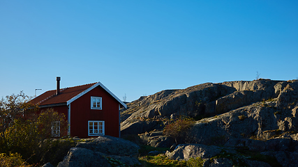 Image showing Red house at sea shore in the baltic sea in dull colors in autumn.