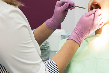 Image showing Dentist working in dentist office