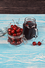 Image showing Cherry juice with glass of berries