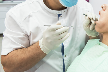 Image showing Dentist working in dentist office