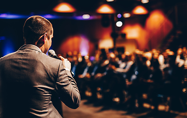 Image showing Public speaker giving talk at Business Event.