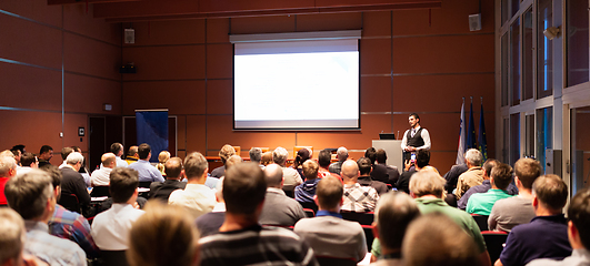 Image showing Business speaker giving a talk at business conference meeting event.