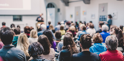 Image showing Man giving presentation in lecture hall at university.