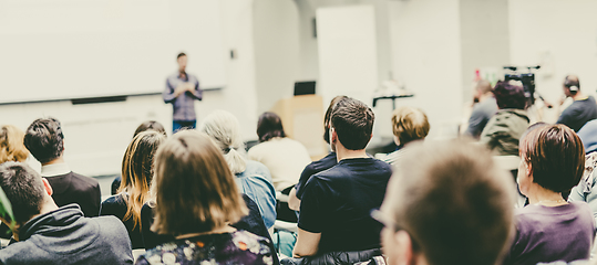 Image showing Man giving presentation in lecture hall at university.