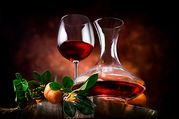 Image showing Tangerine wine on a wooden table