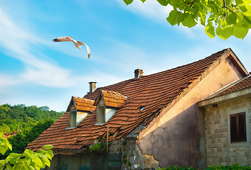 Image showing Tiled roof of an old house