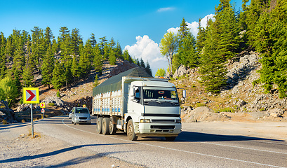 Image showing Truck is driving on the road