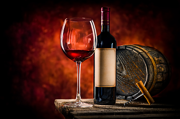 Image showing Wine and barrel on a table