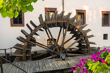 Image showing Wooden mill and flower