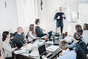 Image showing Relaxed informal IT business startup company team meeting.