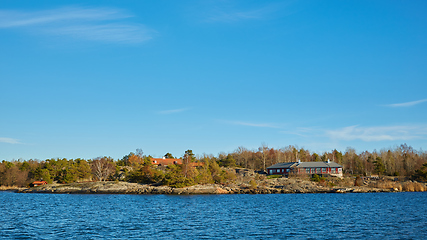 Image showing Red house at sea shore in the baltic sea in dull colors in autumn.